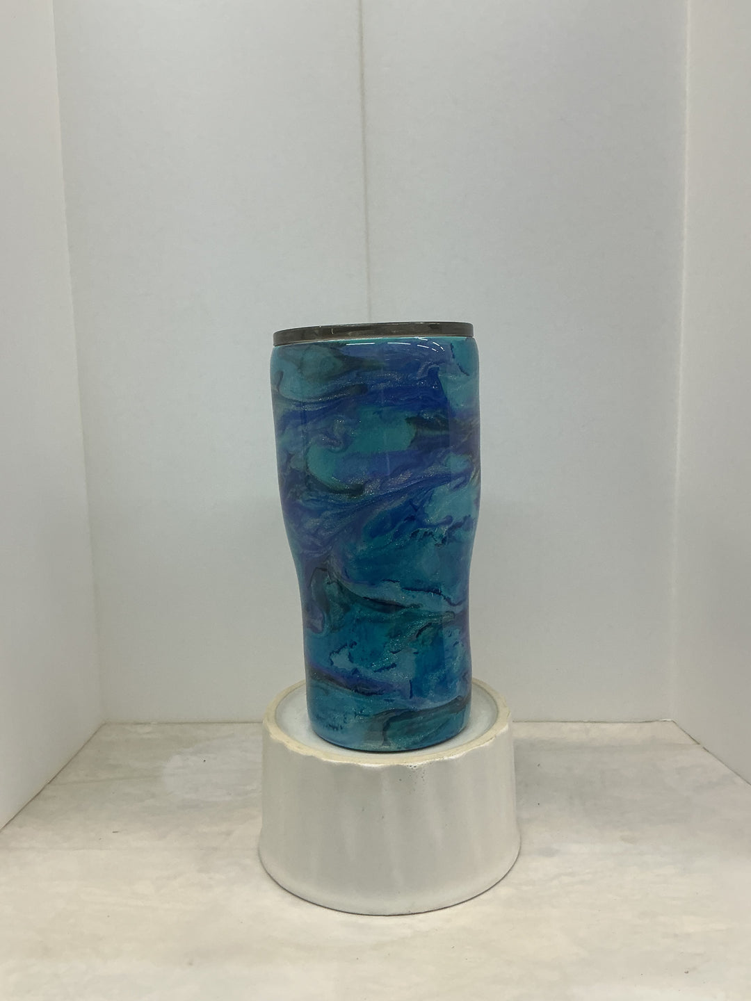 Blue tumbler with vibrant shades and artistic design