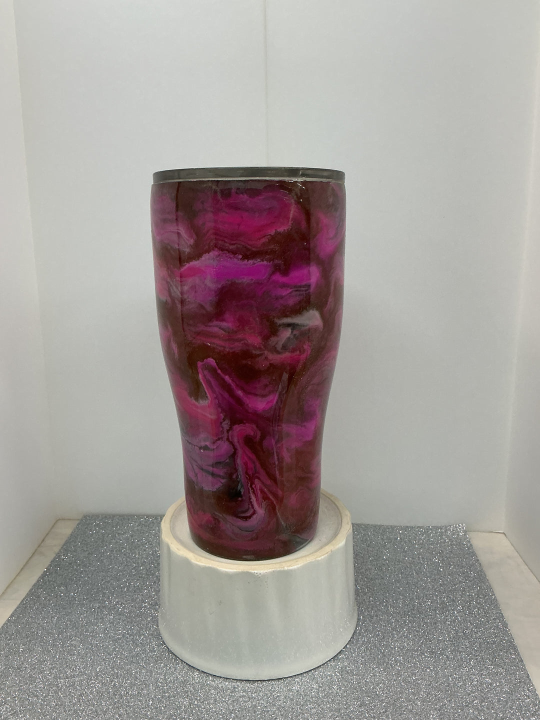 Reds swirled decorative ceramic bowl by Nancy’s Designs featuring vibrant red and white swirling patterns.