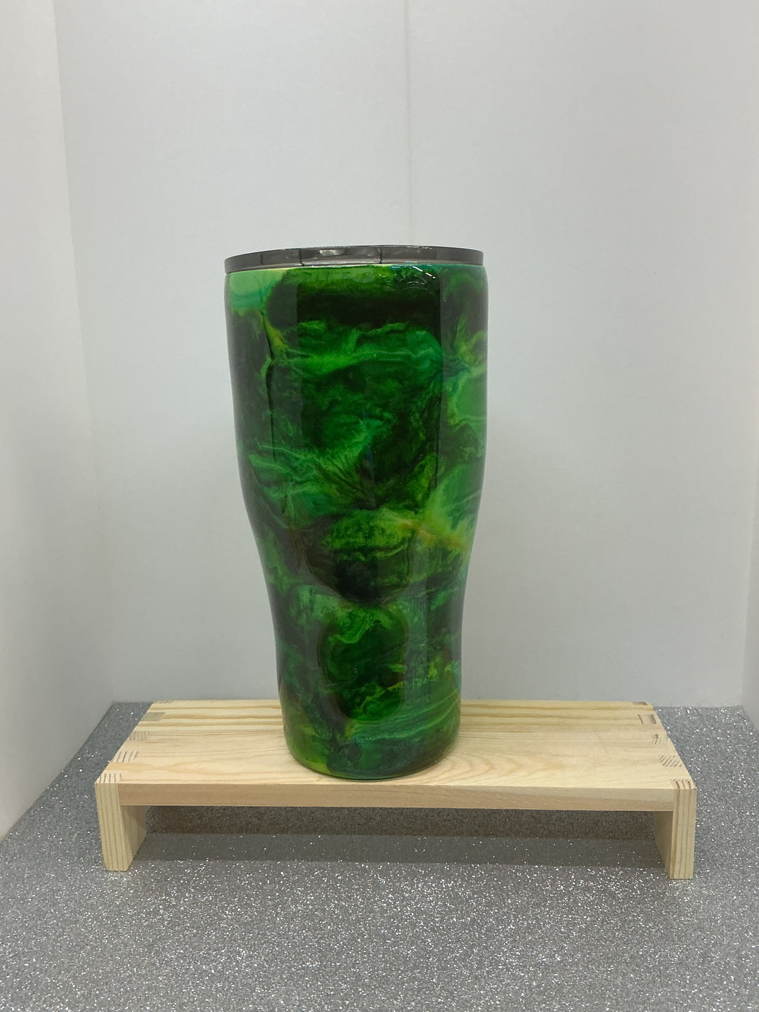 Green swirl pattern fabric by Nancy’s Designs, showcasing vibrant green tones with a flowing, artistic swirl design.
