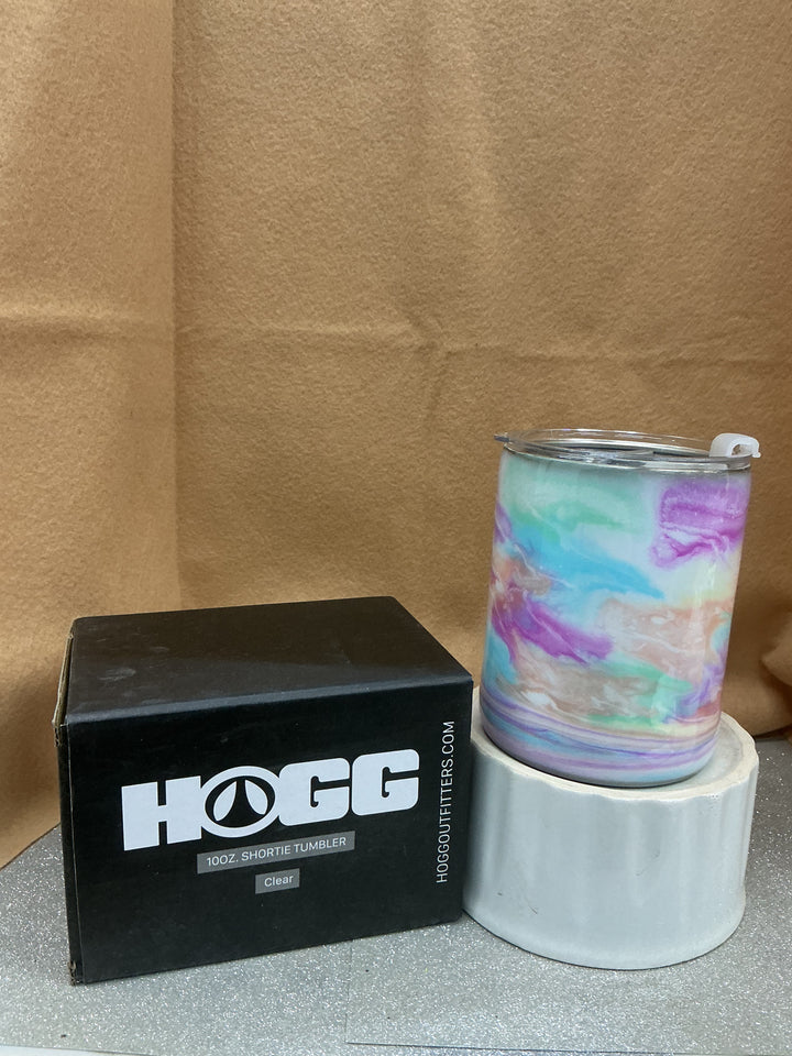 Shortie tumbler with a colorful marbled design, clear lid, displayed on a white stand, by Nancy’s Designs.